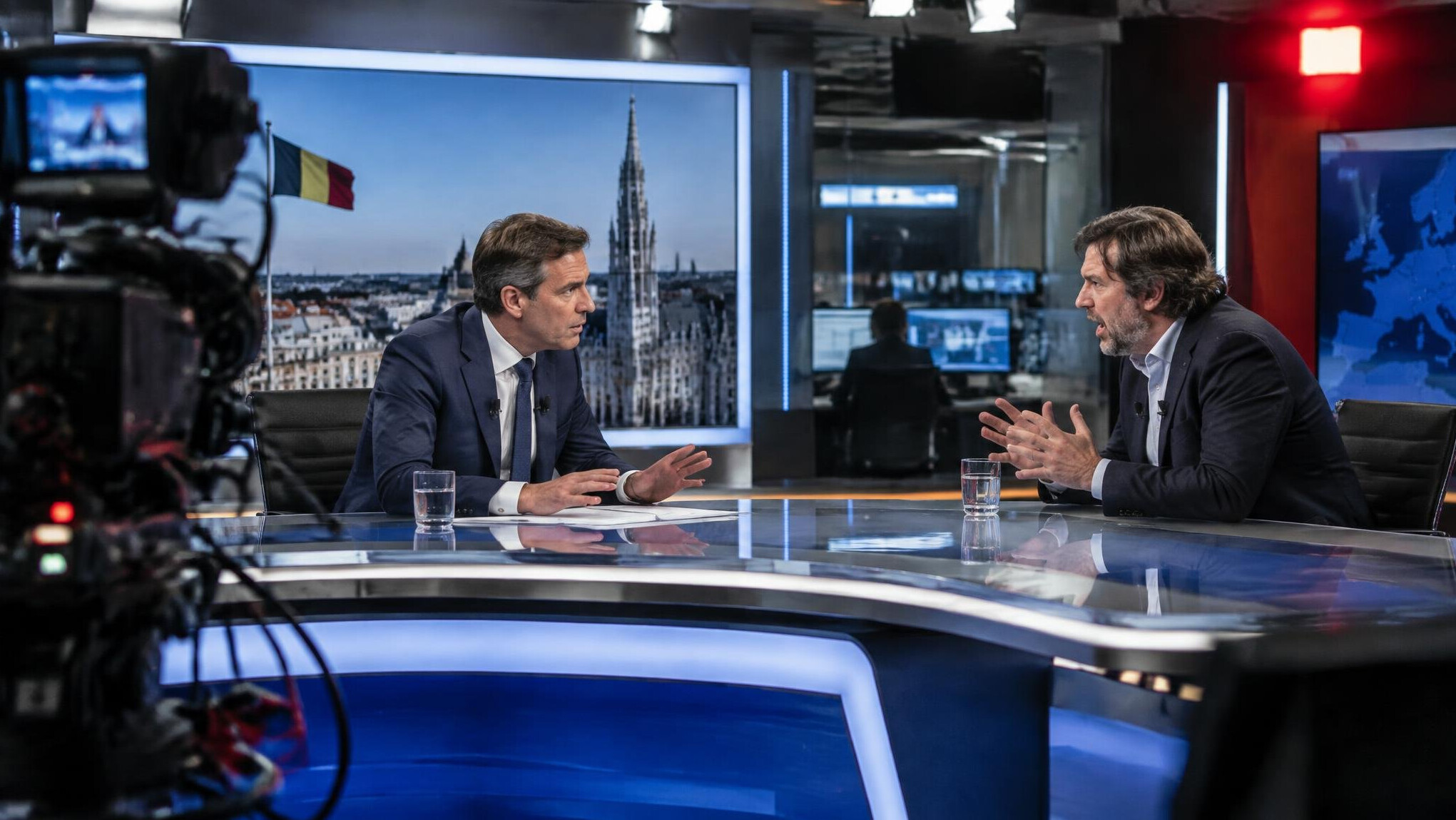 News anchor and guest in heated discussion during a live TV broadcast