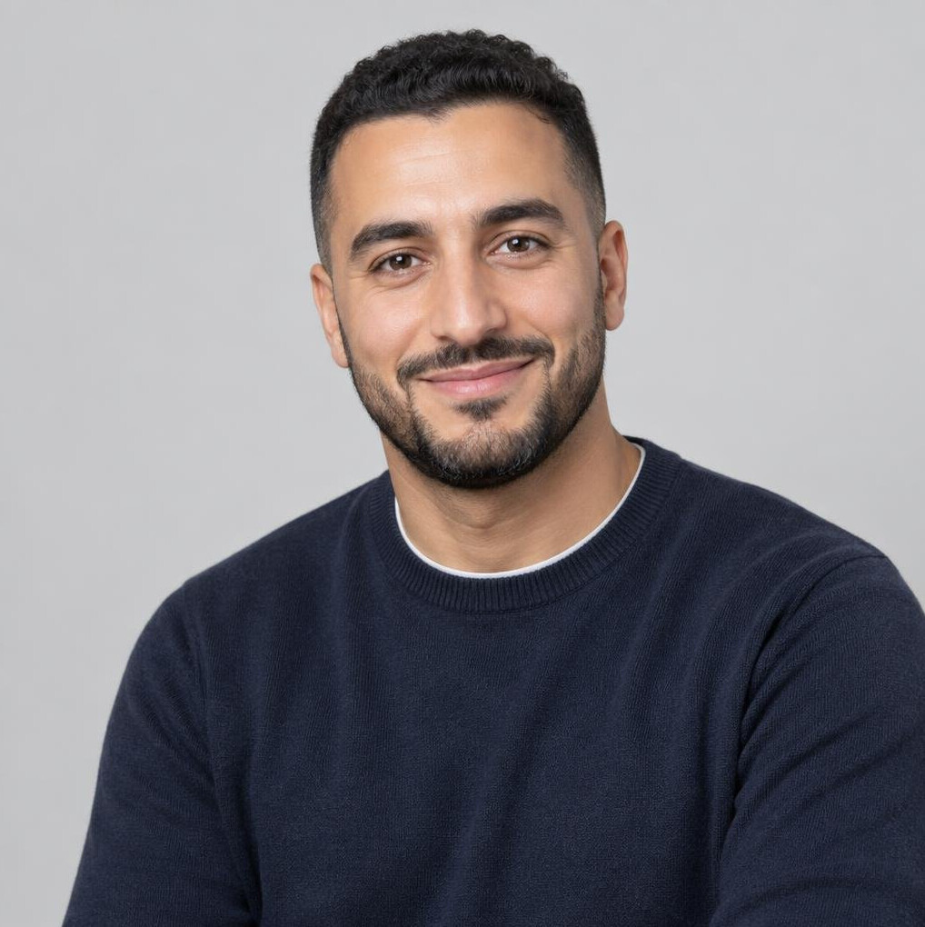 Belgian man of North African descent in his 30s, professional headshot